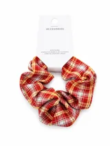 Colero para el pelo con diseño estampado a cuadros en tonos rojo, blanco y amarillo.