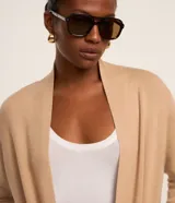 Cardigan alargado de punto marca Cortelle, color marrón, abierto al frente, de manga larga y con bolsillos aplicados.