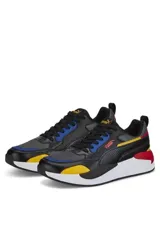 Championes deportivos Puma X-Ray, color negro con detalles multicolor en amarillo, azul y rojo. Suela blanca y diseño robusto de inspiración retro.