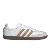 Championes Adidas Samba Og color blanco con detalles en marrón y suela de goma marrón. Presentan las tres tiras características de Adidas en los laterales y puntera de gamuza color beige.