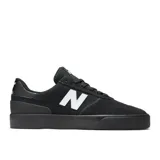 Championes urbanos New Balance modelo NM272, color negro con logo "N" en blanco en los laterales, confeccionados en gamuza y lona.