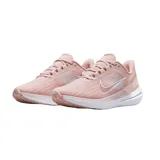 Championes de running Nike Air Winflo 9, color gris oscuro con detalles en cobre y plateado. Presentan diseño aerodinámico con logo lateral metalizado, entresuela blanca amortiguada y suela con relieve para mayor tracción.