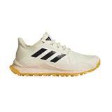 Championes Adidas para hockey sobre hierba, modelo Hockey Youngstar. Color crema con detalles en negro y suela color caramelo.