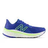 Championes de running New Balance Vongo v5 para hombre, color azul con detalles en verde.