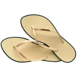 Ojotas Havaianas modelo Slim Point, con base color violeta claro y borde lateral en tono rojizo. Presentan tiras finas con textura y logo de la marca en relieve.