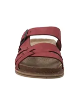 Sandalias de cuero color bordó, con diseño de tiras cruzadas en el empeine y una tira ajustable con hebilla metálica. Cuenta con plantilla acolchada y suela de corcho con base de goma antideslizante.