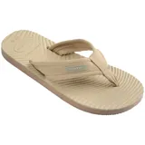 Ojotas Havaianas Surfer Coast, color negro, con tiras de tela texturizada y suela con diseño ondulado.