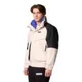 Campera técnica Columbia de la colección Iconos, con diseño impermeable y transpirable Omni-Tech. Presenta un estilo retro con bloques de color en crema y negro, cuello alto con forro interior azul, cierre frontal con solapa protectora y múltiples bolsillos. Incluye sistema de intercambio con cremallera para usar con forro reversible.
