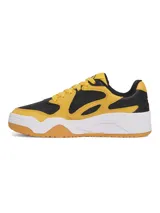 Championes Under Armour modelo Court Anatomix, con diseño bicolor en amarillo y negro. Presentan una parte superior con superposiciones resistentes, entresuela de EVA acolchada y suela exterior de goma gruesa para mayor tracción y durabilidad.