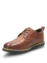 Zapato casual Hush Puppies modelo Bolo, confeccionado en cuero color marrón con costuras a la vista. Presenta cierre mediante cordones, interior forrado y suela de EVA flexible con diseño ergonómico.