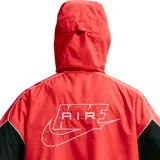 Campera deportiva Nike Air con capucha, diseño en color naranja con paneles laterales negros y detalles en blanco. Cuenta con cierre frontal completo y parche con logo en el pecho.