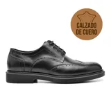 Zapato de vestir acordonado de cuero negro con detalles de perforaciones y suela de goma.