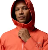 Campera cortaviento impermeable y transpirable Columbia Trailborne 2.5L Shell, plegable y compacta, combinada en color gris y naranja.