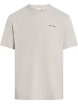 Remera Calvin Klein de corte regular y mangas cortas, color gris, con cuello redondo y micro logo impreso en el pecho.