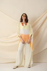 Pantalón palazzo de gasa color blanco, con cintura alta y lazo ajustable.