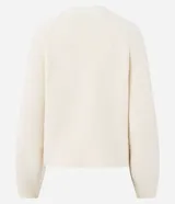 Cardigan de punto color crema con calce oversize, mangas amplias y cierre frontal mediante hebillas metálicas decorativas. Presenta una textura estructurada y puños ajustados.