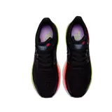 Championes de running New Balance, color negro con detalles en violeta, naranja y verde.