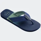 Ojotas Havaianas Urban Print con base verde militar y verde neón, tiras anchas bicolores con logo de la marca.