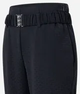 Pantalón recto color verde agua, de jacquard texturizado, con cinturón elástico con hebilla y cierre lateral.