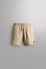Short deportivo Zara Athleticz de color marrón, confeccionado en tejido técnico ligero y elástico con forro interior. Cuenta con cintura elástica ajustable con cordón, bolsillos frontales, bolsillo trasero con cierre de cremallera, bajo con aberturas laterales y detalle de logo estampado en la pierna.