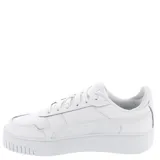 Championes Puma modelo Carina Street con plataforma, de diseño urbano y deportivo. Presentan una silueta clásica en color blanco con detalles de la marca en tono dorado en el lateral y la lengüeta, y suela de goma elevada.