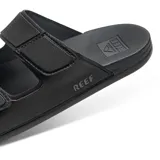 Sandalias Reef Cushion Tradewind negras con doble tira ajustable con velcro y logo de la marca en el lateral.