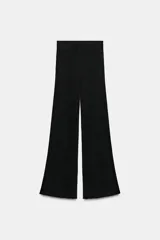 Pantalón ancho negro de punto rib con cintura elástica.