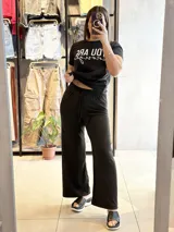 Pantalón palazzo negro de morley con cintura elastizada y cordón ajustable.