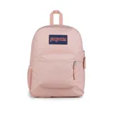 Mochila JanSport color rosa con logo rectangular azul y blanco. Tiene un compartimento principal grande, un bolsillo lateral para botella de agua, un bolsillo frontal con cremallera, tirantes acolchados y panel trasero acolchado.