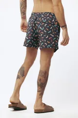 Short de baño con estampado tropical de hojas y loros, con cordón ajustable en la cintura.
