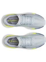 Championes de running Under Armour Velociti Pro 2, color gris con entresuela blanca, detalles en amarillo flúor y azul, y el logo de la marca en el lateral.