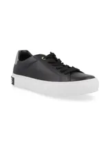Championes urbanos Hush Puppies modelo Hush, color negro con suela de plataforma blanca. Confeccionados en cuero, presentan cordones negros y un detalle de marca en la parte trasera de la suela.