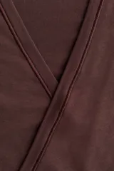 Top de deporte cruzado en modal suave, de manga larga, con escote en V pronunciado y tiras para anudar en la cintura.