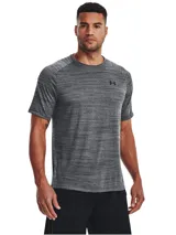 Remera deportiva Under Armour de manga corta, confeccionada en tejido técnico ultrasuave de secado rápido con textura jaspeada. Presenta cuello redondo y logo de la marca estampado en el pecho.