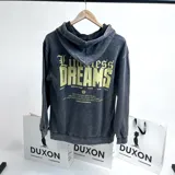 Canguro gris con efecto lavado y capucha, con estampa amarilla en la espalda con la frase "Limitless Dreams".