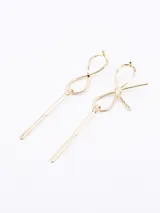 Set de dos broches dorados para el pelo: uno con forma de moño y otro con forma de infinito.