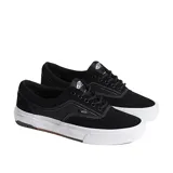Championes de skate Vans modelo Era Wafflecup, color negro con suela blanca. Presentan capellada de gamuza, cuello acolchado, refuerzo DuraCap en zonas de desgaste y plantilla PopCush para mayor amortiguación.