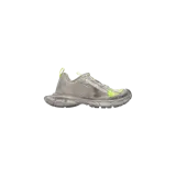 Championes Balenciaga 3XL de efecto desgastado, en tono gris con detalles en verde flúor, diseño voluminoso y suela exagerada.