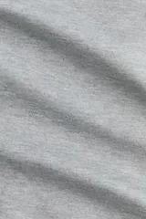 Body de manga larga confeccionado en punto roma pesado, con diseño de hombros al descubierto y escote de doble capa con forma ligeramente en V.