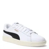 Championes urbanos Puma Smash 3.0 L, color blanco con franja lateral negra y detalles en dorado. Confeccionados en cuero sintético con suela de goma en tono crema.