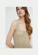 Vestido midi color beige de punto calado con aberturas, breteles anchos y combinación interior al tono.