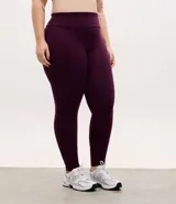 Calza legging deportiva de poliamida color marrón, con cintura alta de 10 cm y diseño ajustado al cuerpo.