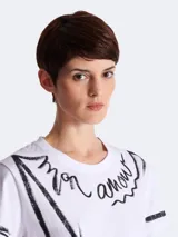 Remera blanca de algodón con estampado de la frase 'Je t'aime' en negro, de la marca Balmain.