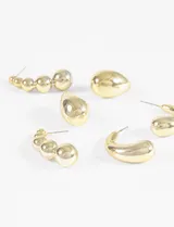 Set de aros plateados con diferentes diseños: aros tipo gota, aros tipo argolla y aros tipo trepadores con esferas.