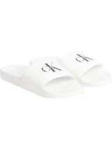 Ojotas blancas de Calvin Klein Jeans con logo CK en negro.
