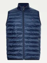 Chaleco acolchado azul marino con cierre de cremallera, cuello alto y logo de Tommy Hilfiger bordado en el pecho.