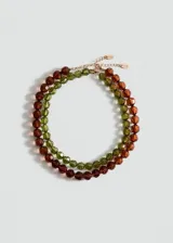 Pack de dos collares con diseño de cuentas facetadas de cristal en tonos marrón y verde, con cierre de cadena y mosquetón metálico.
