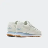 Championes Reebok Glide para mujer, color blanco con detalles en celeste y suela color caramelo.