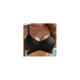 Conjunto de bikini de dos piezas de la marca Uniteduy, compuesto por un crop top amarillo liso con diseño cruzado y tirantes finos, y una bombacha de tiro alto con estampado floral y de hojas en tonos amarillos, verdes y blancos.