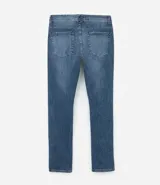 Pantalón de jean elastizado azul con lavado nevado, corte skinny y tiro medio.